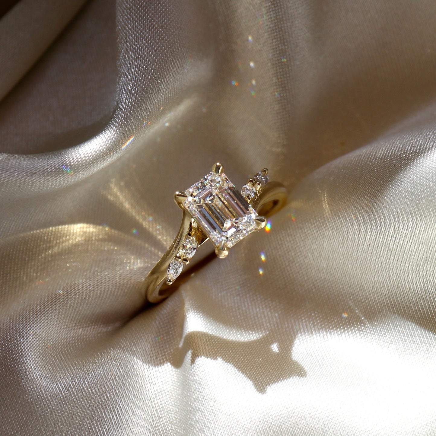 The Amira Ring™ - Emerald with Marquise Accents