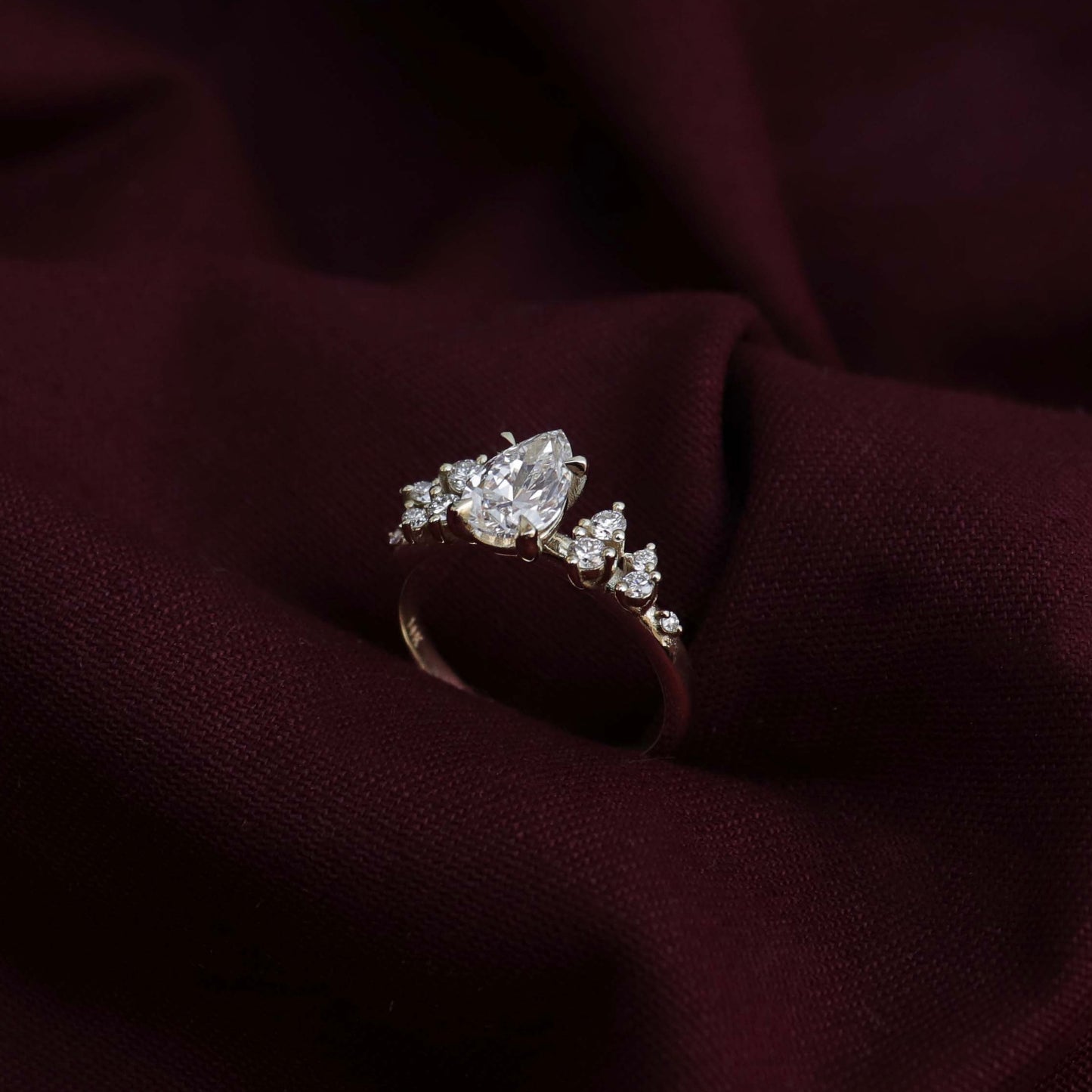 The Aurora Ring - Pear with Round Brilliant Accents