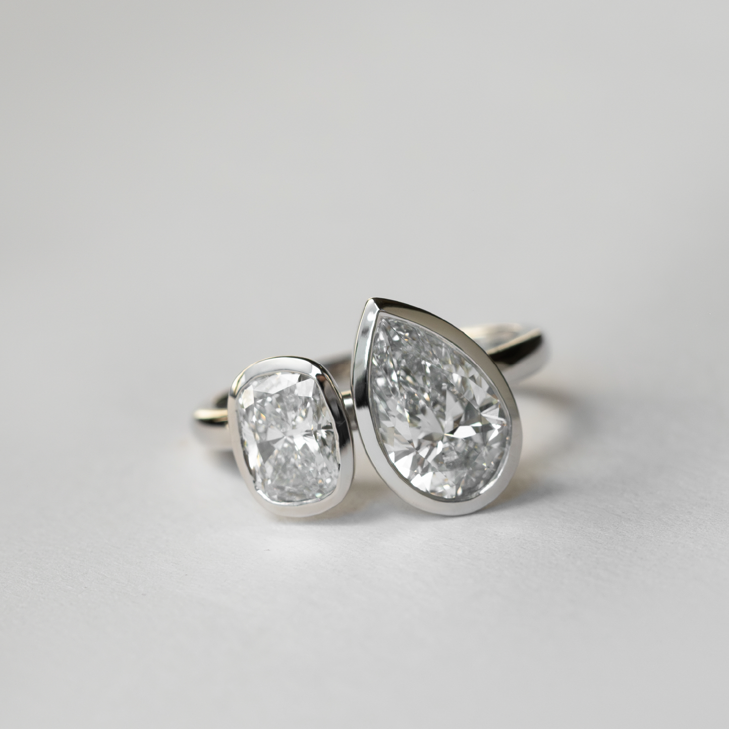 The Anaïs Ring - Elongated Cushion and Pear Bezel Toi et Moi