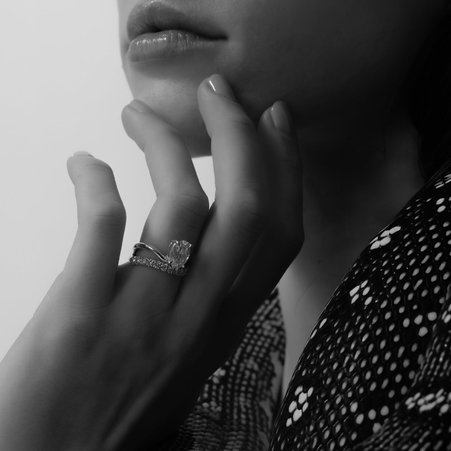 The Elijah Ring - Floating Oval Solitaire with Pavé Band