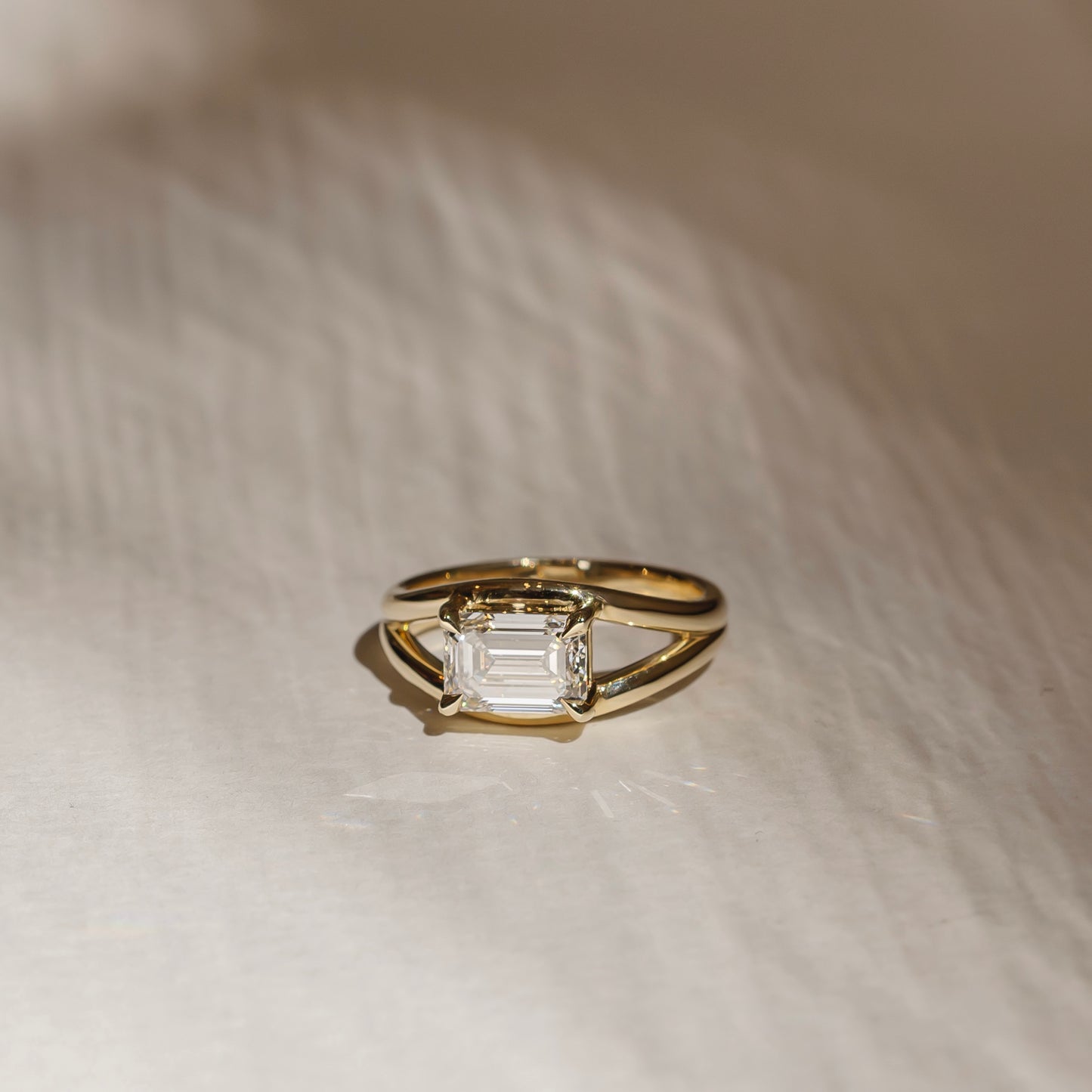 The Aleasa Ring - Split Shank East-West Emerald Solitaire