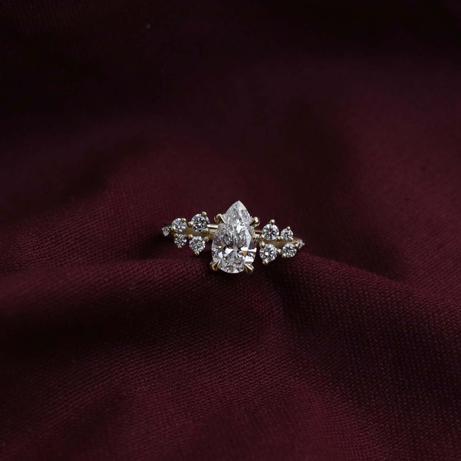 The Aurora Ring - Pear with Round Brilliant Accents