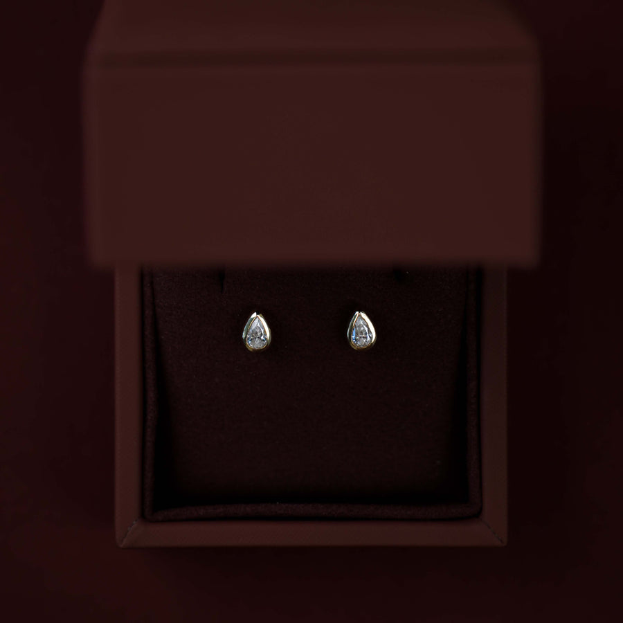 The Vera Earrings - 0.3ct Moissanite Pear Bezel Studs