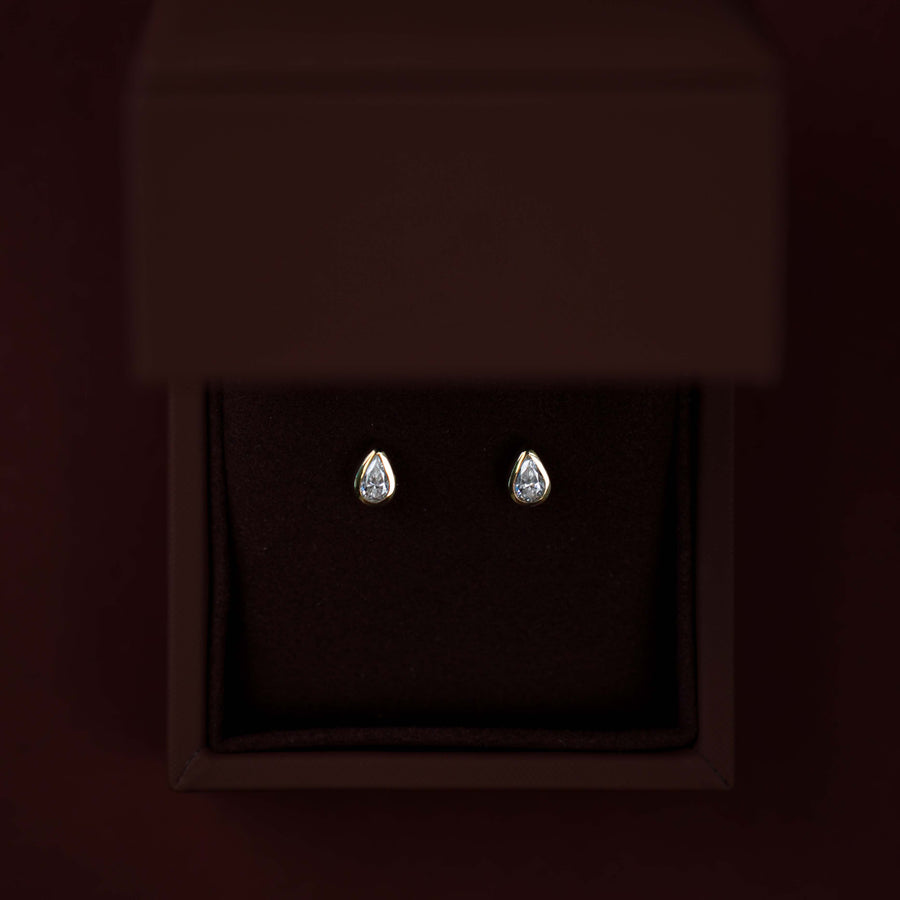The Vera Earrings - 0.3ct Moissanite Pear Bezel Studs