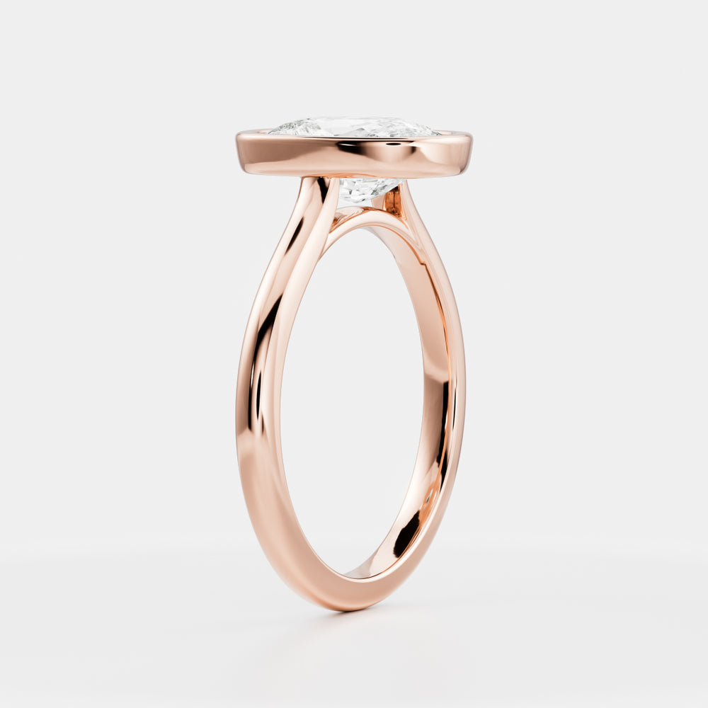 
                      
                        The Ophelia Ring - Elongated Cushion Bezel Solitaire
                      
                    