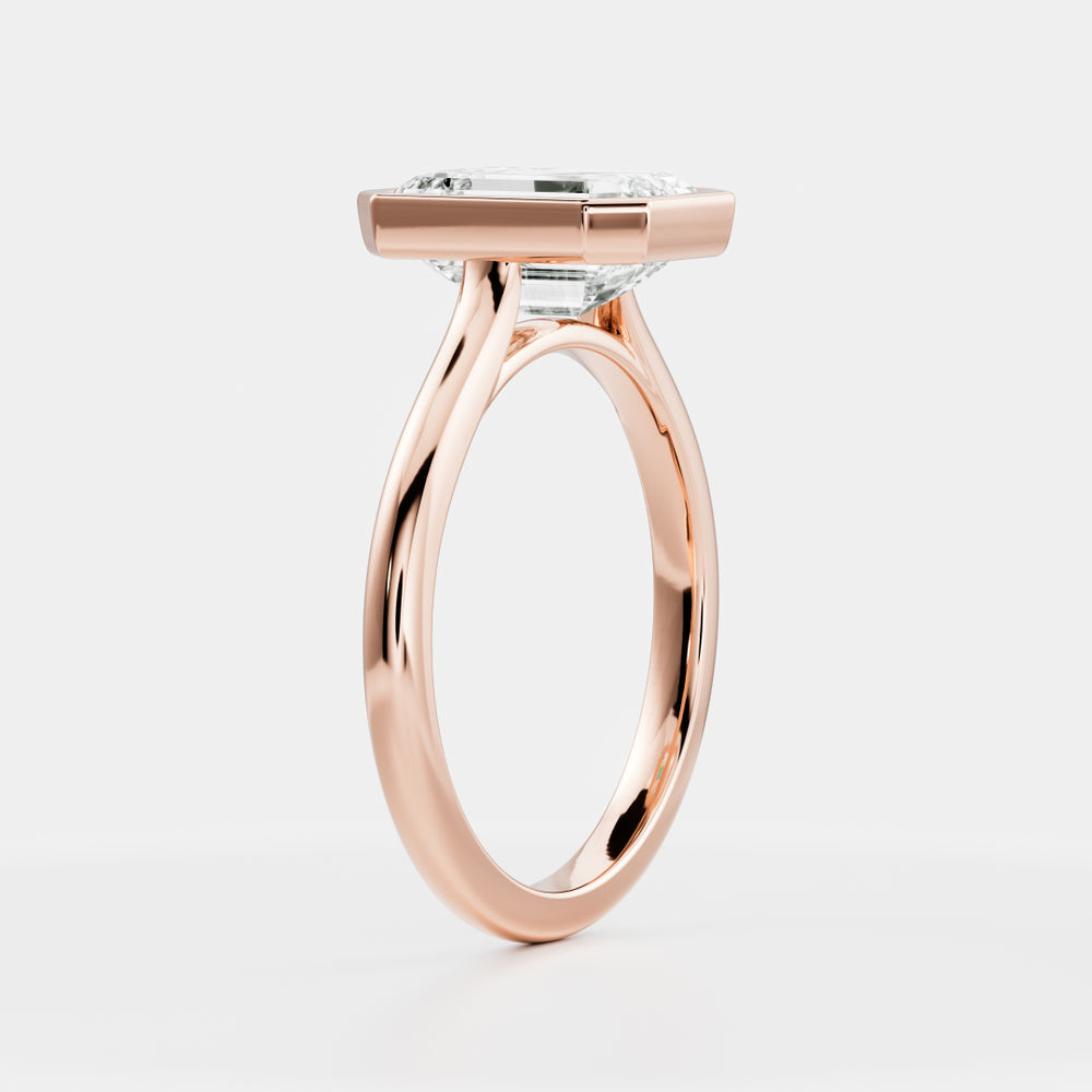 
                      
                        The Audrey Ring - Emerald Bezel Solitaire
                      
                    