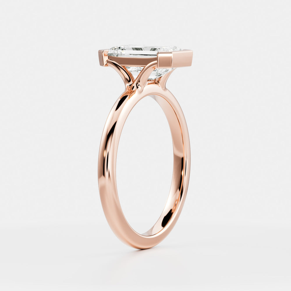 
                      
                        The Audrey Ring - Emerald Half Bezel Solitaire
                      
                    
