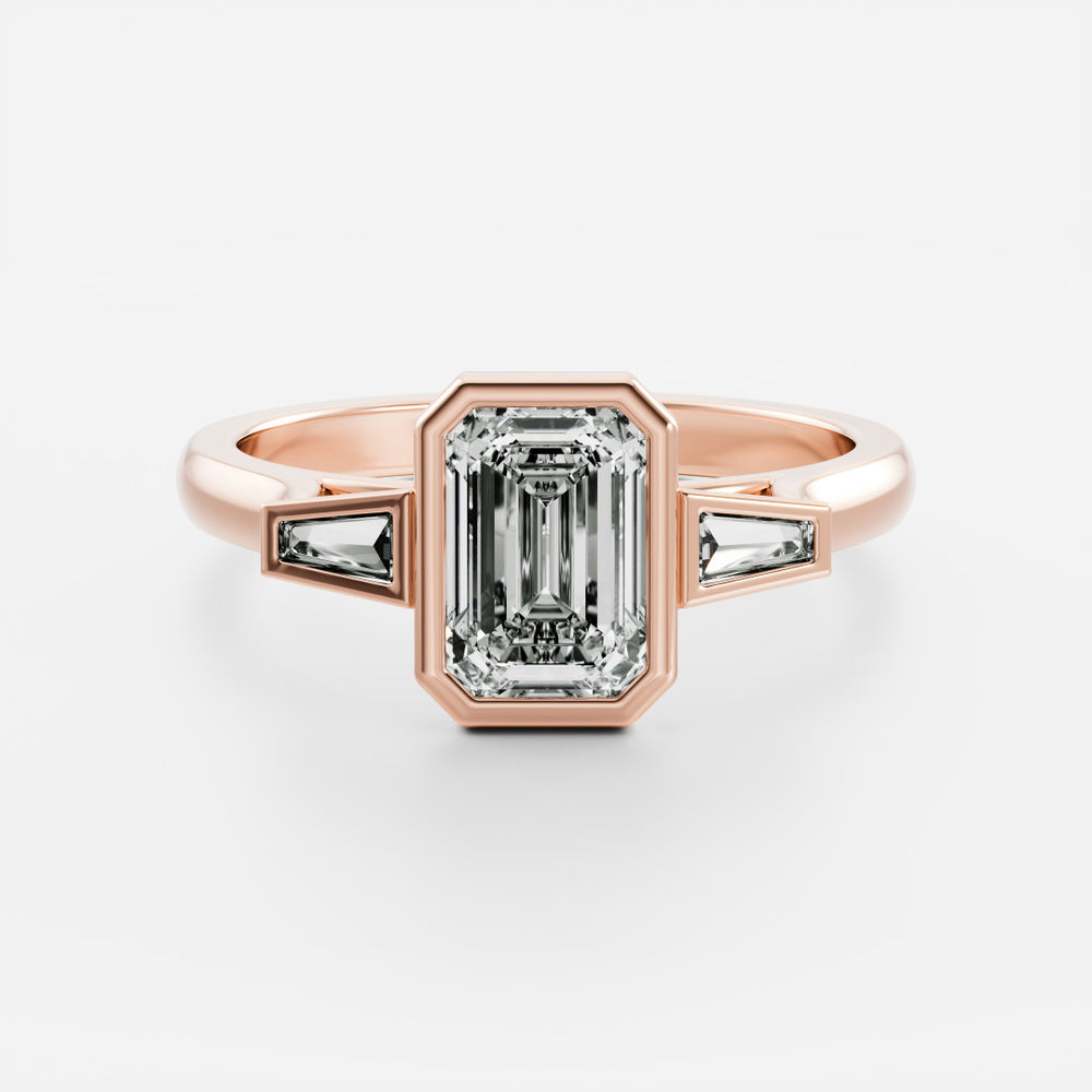 
                      
                        The René Ring - Emerald and Tapered Baguette Trilogy
                      
                    