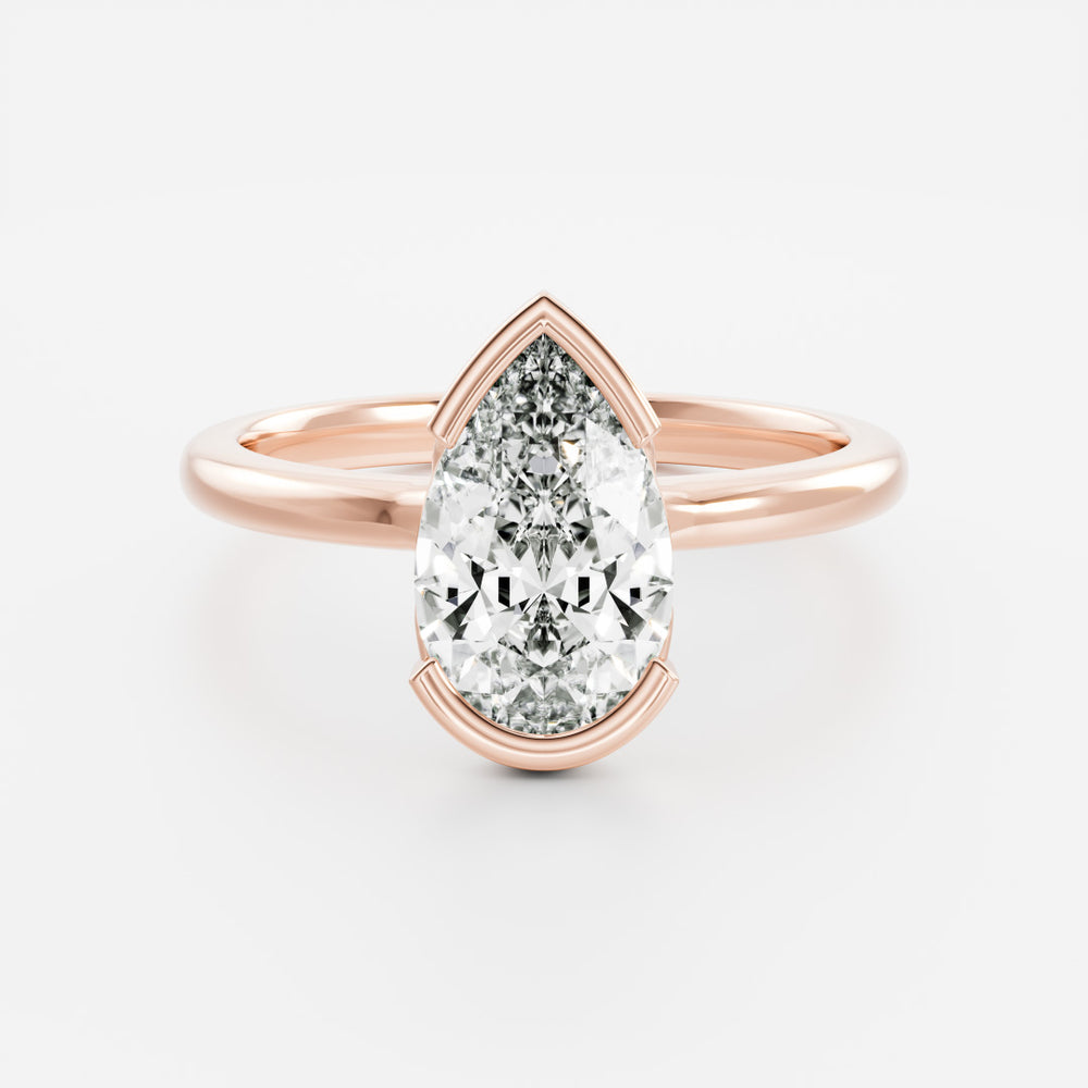 
                      
                        The Sophia Ring - Pear Half Bezel Solitaire
                      
                    