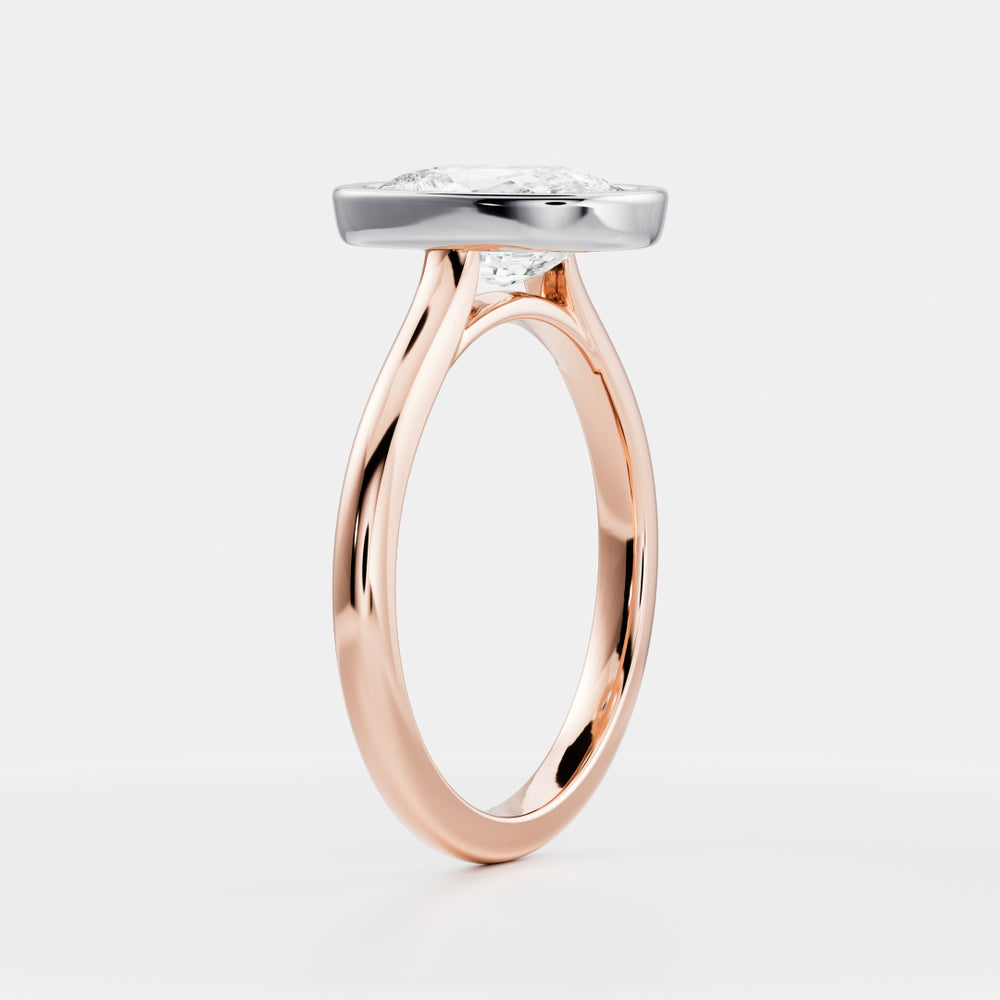 
                      
                        The Ophelia Ring - Elongated Cushion Bezel Solitaire
                      
                    