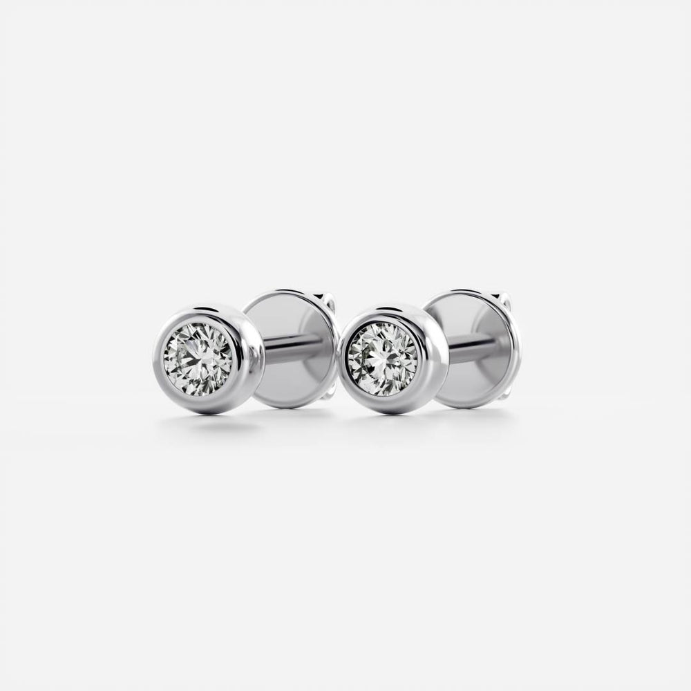 
                      
                        The Vera Earrings - Round Bezel Studs
                      
                    
