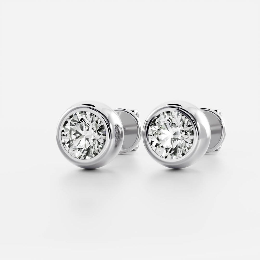 
                      
                        The Vera Earrings - Round Bezel Studs
                      
                    