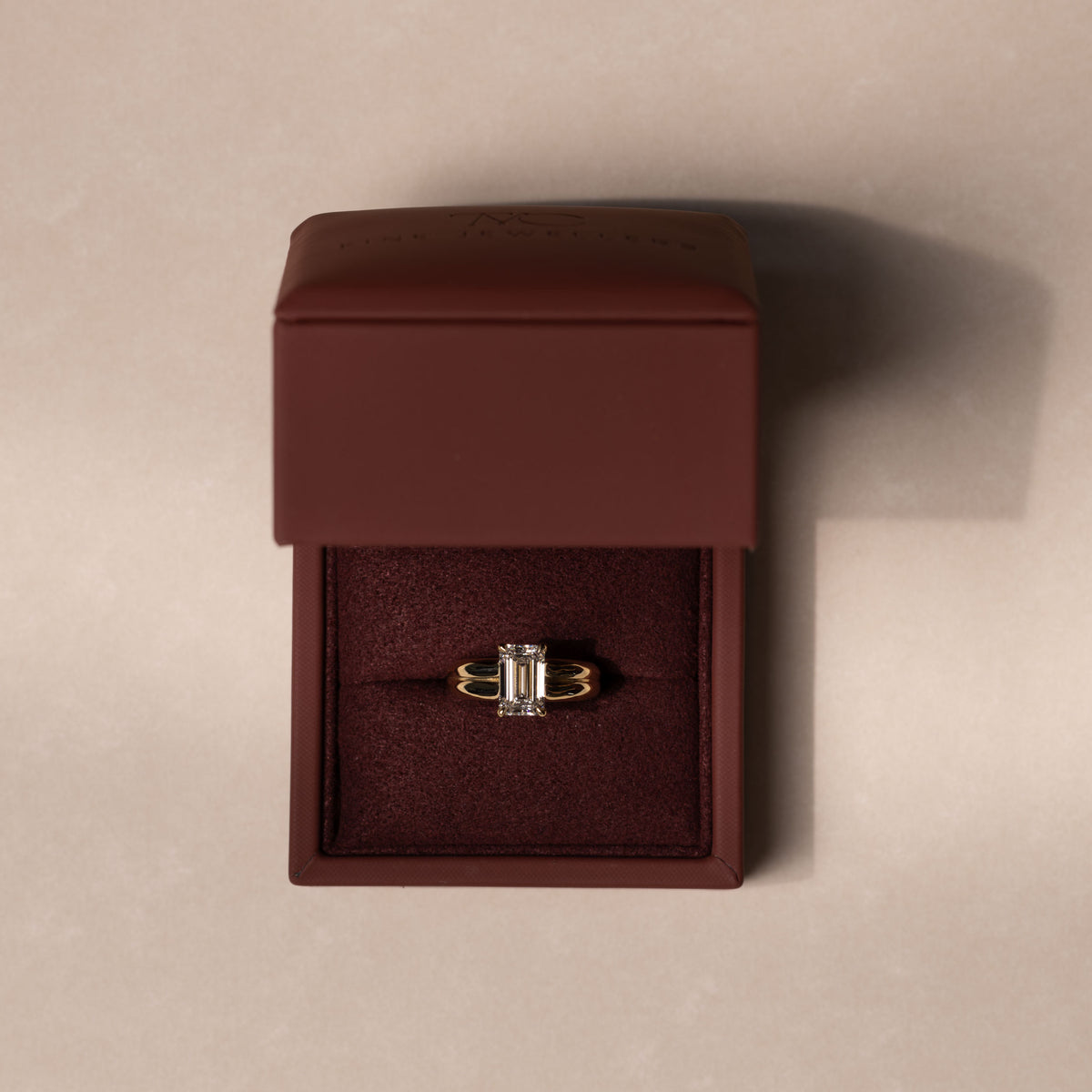 The Adele Ring - Low Set Emerald Double Band Solitaire