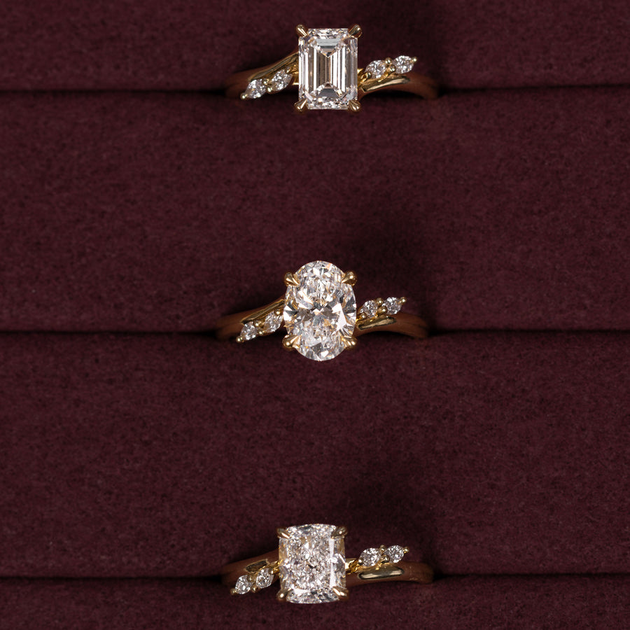 The Amira Ring™ - Emerald with Marquise Accents
