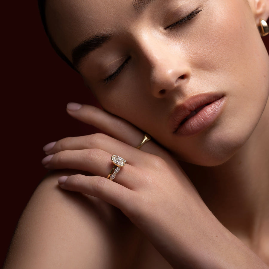The Luise Ring® - Oval Half Bezel Solitaire