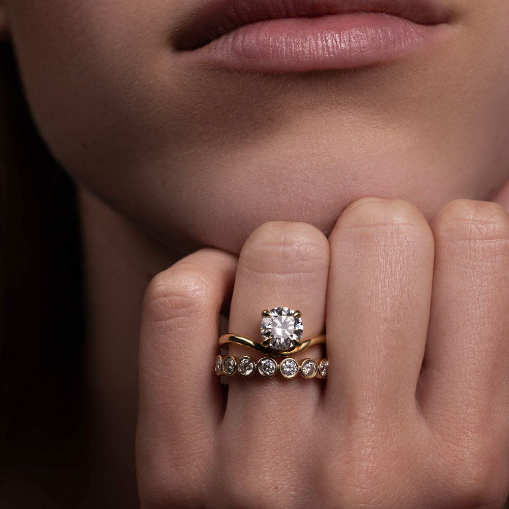 
                      
                        The Maya Ring - Round Curved Solitaire
                      
                    
