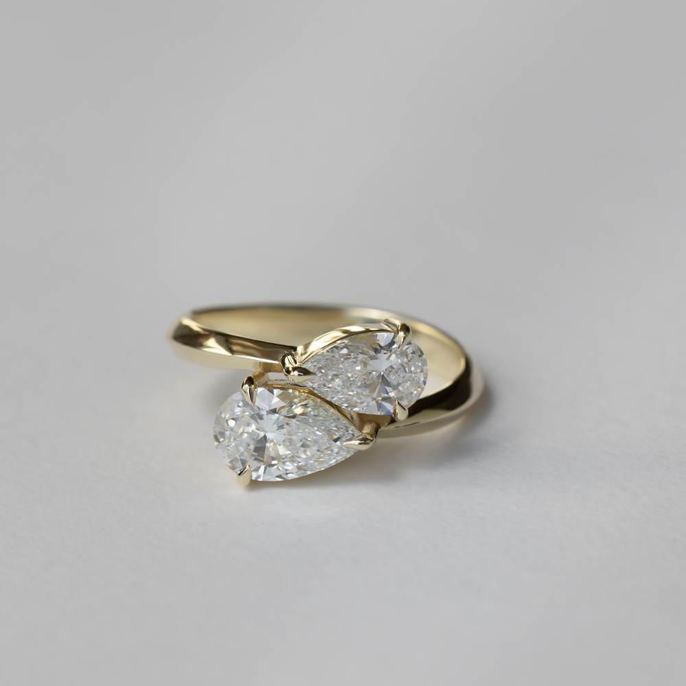 
                      
                        The Isabeau Ring - Twisted Knife Edge Pear Toi et Moi
                      
                    