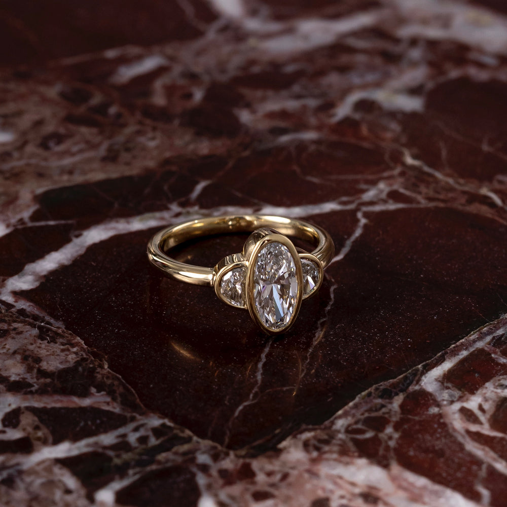 
                      
                        The Margot Ring - Oval and Half Moon Bezel Trilogy
                      
                    