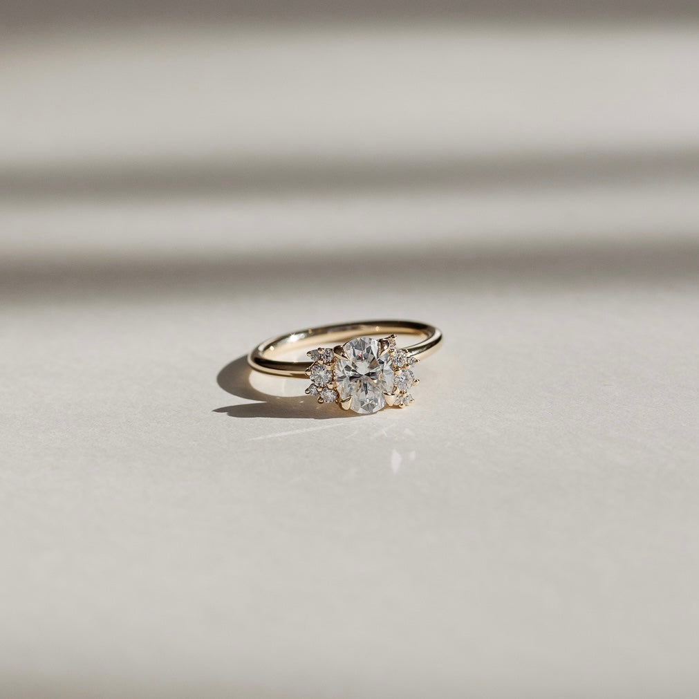 The Fleur Ring - Oval With Round Brilliant Accent Stones