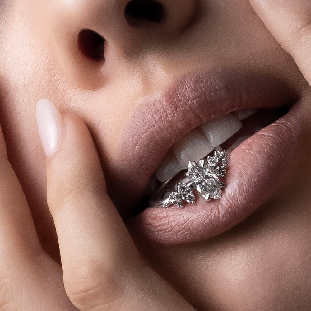 
                      
                        The Aurora Ring - Oval with Round Brilliant Accents
                      
                    