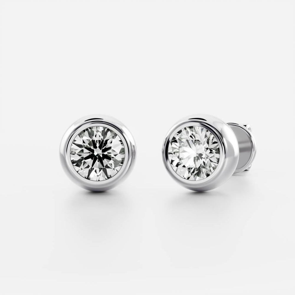
                      
                        The Vera Earrings - Round Bezel Studs
                      
                    