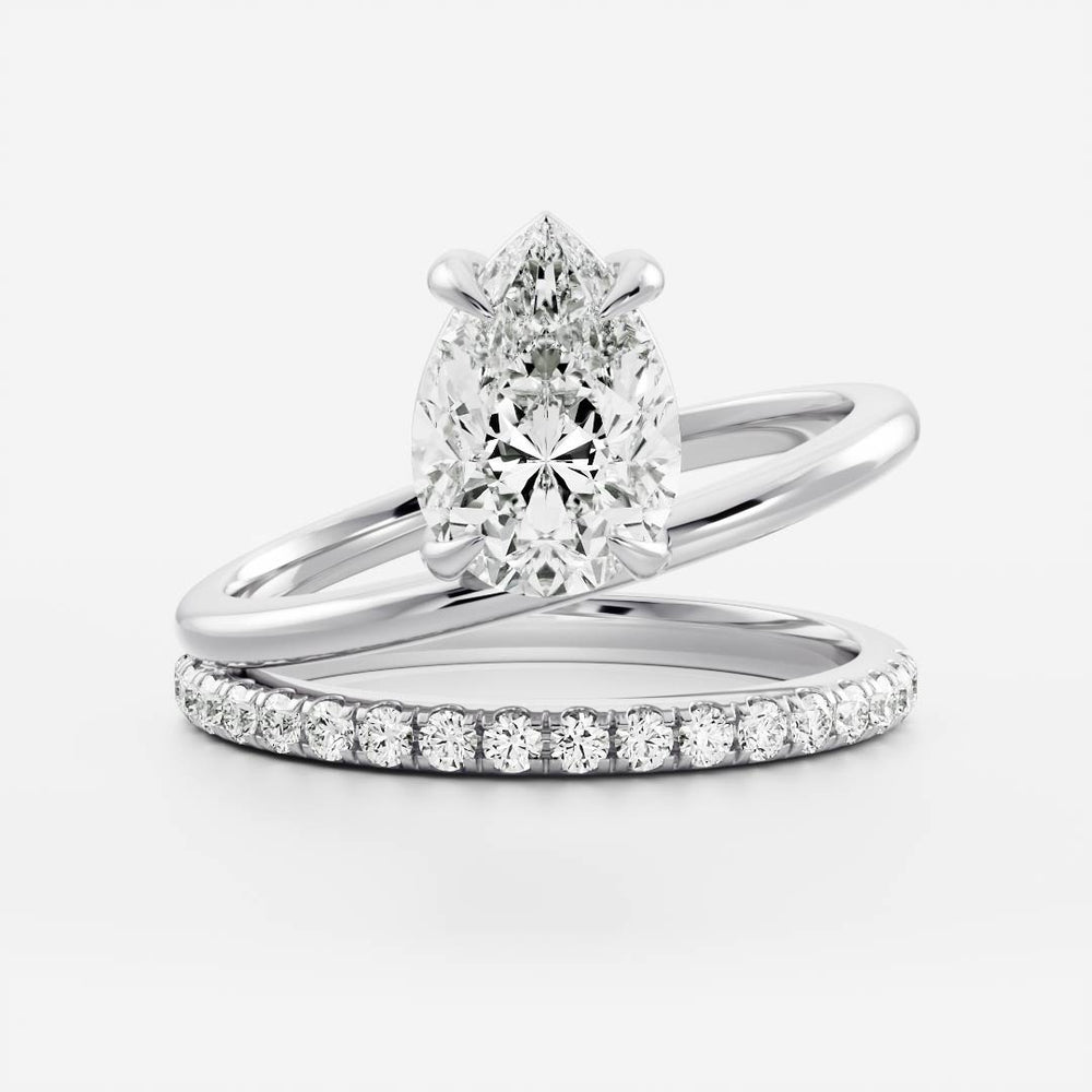 
                      
                        The Emerie Ring - Pear Double Band Solitaire
                      
                    