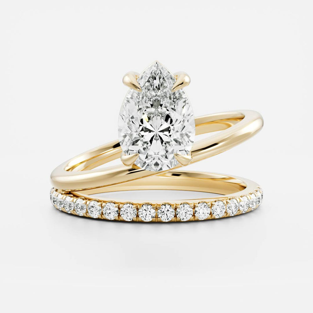 
                      
                        The Emerie Ring - Pear Double Band Solitaire
                      
                    