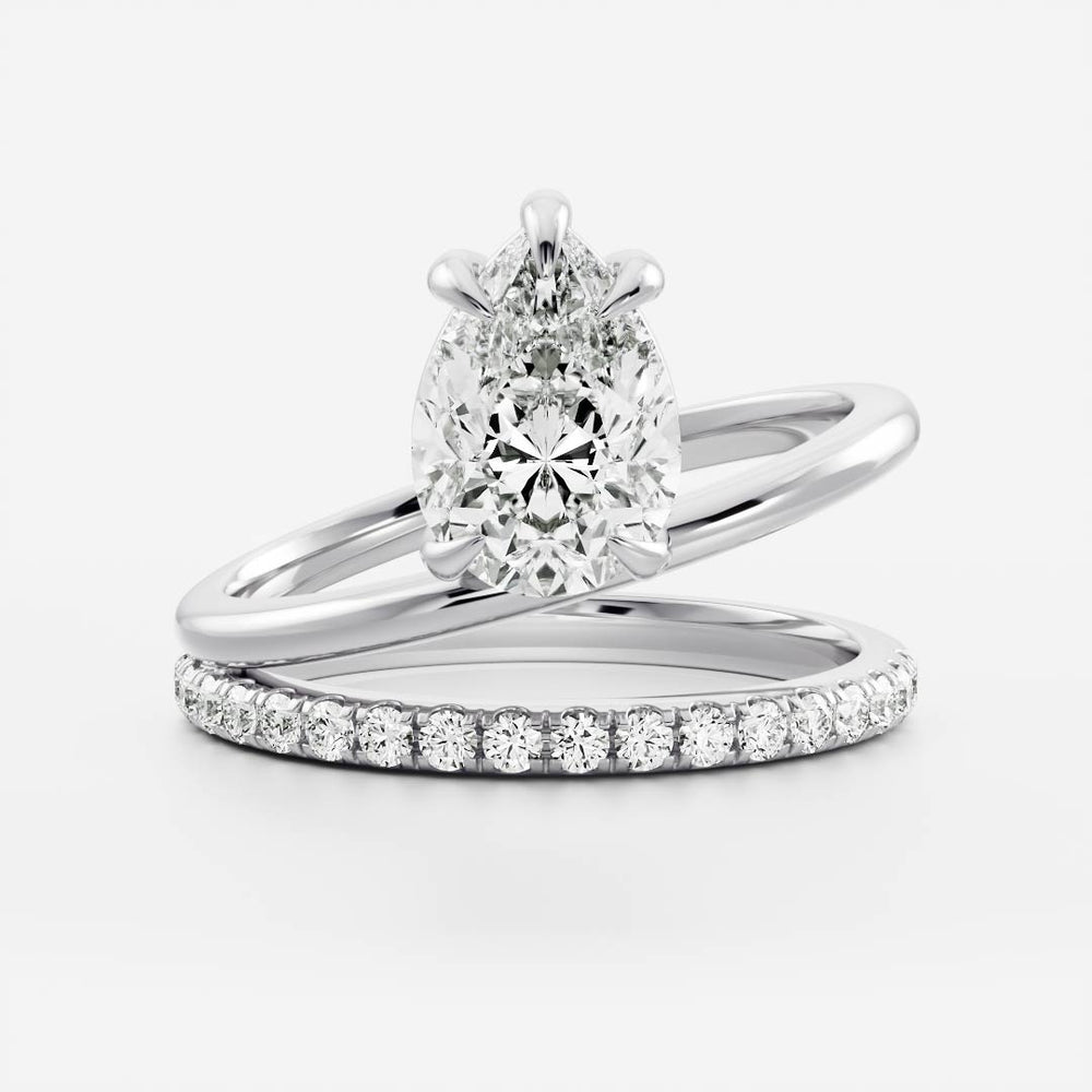 
                      
                        The Emerie Ring - Pear Double Band Solitaire
                      
                    