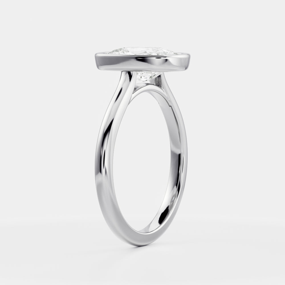 
                      
                        The Ophelia Ring - Elongated Cushion Bezel Solitaire
                      
                    