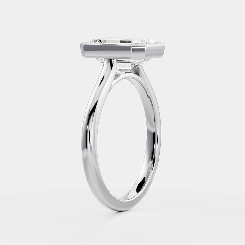 
                      
                        The Audrey Ring - Emerald Bezel Solitaire
                      
                    