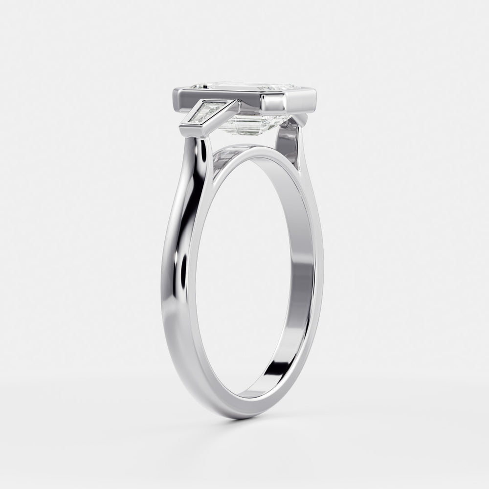 
                      
                        The René Ring - Emerald and Tapered Baguette Trilogy
                      
                    