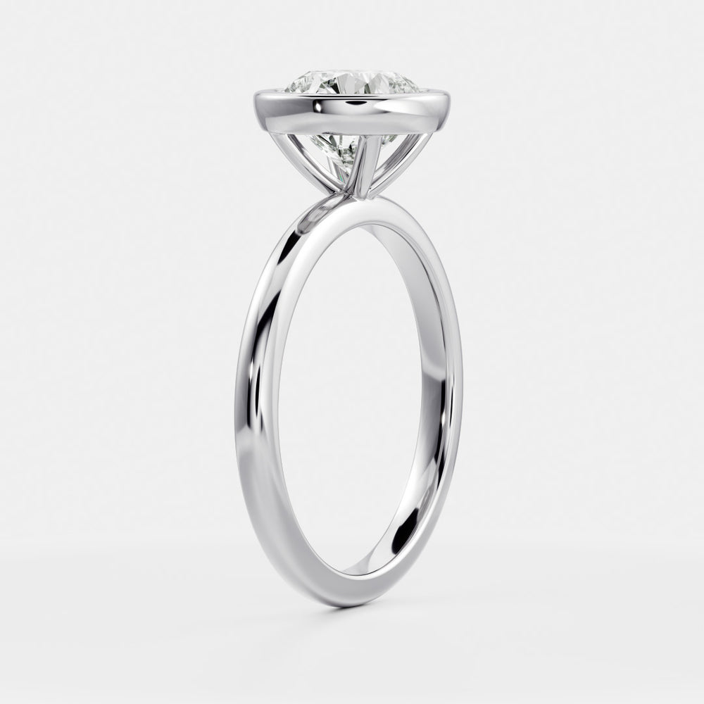 
                      
                        The Isla Ring - Round Bezel Solitaire
                      
                    