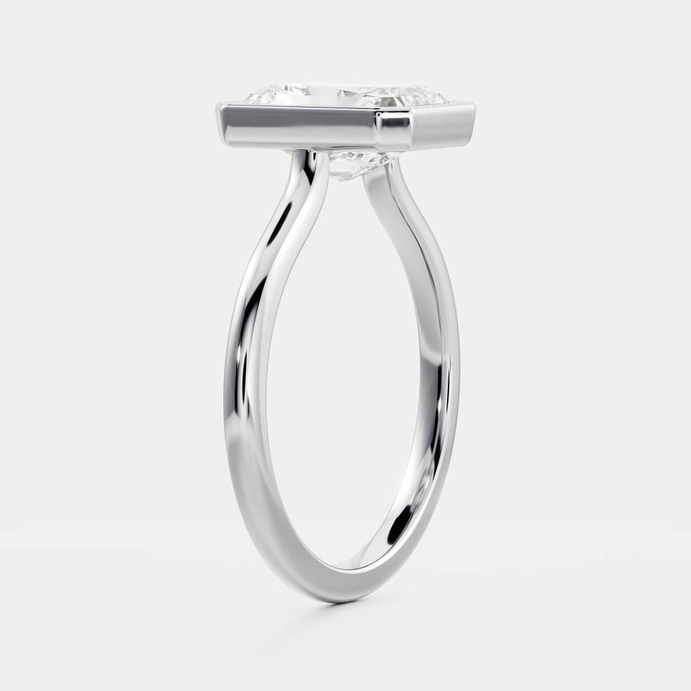 
                      
                        The Vienna Ring - Radiant Bezel Solitaire
                      
                    