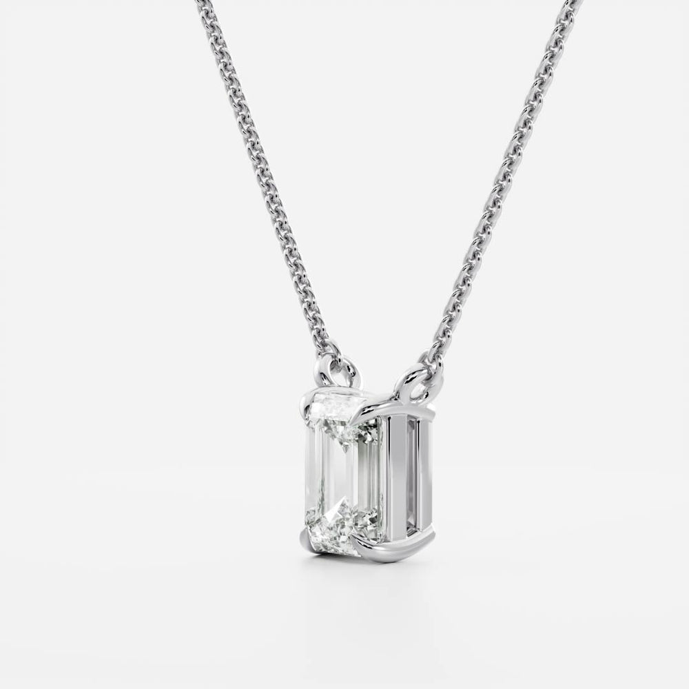 
                      
                        The Iris Necklace - Emerald Pendant
                      
                    