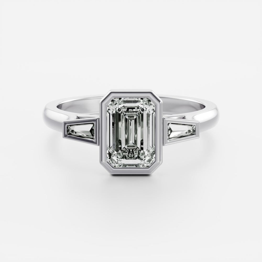 
                      
                        The René Ring - Emerald and Tapered Baguette Trilogy
                      
                    