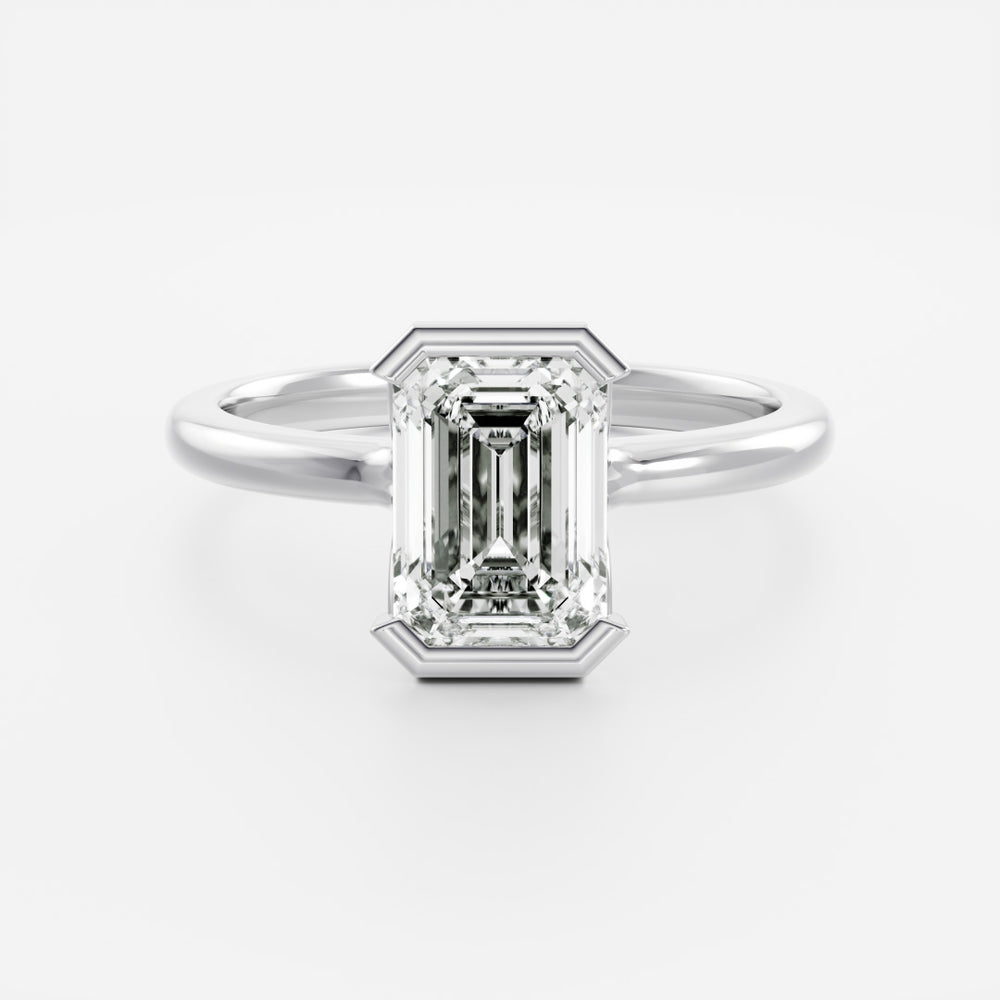 
                      
                        The Audrey Ring - Emerald Half Bezel Solitaire
                      
                    