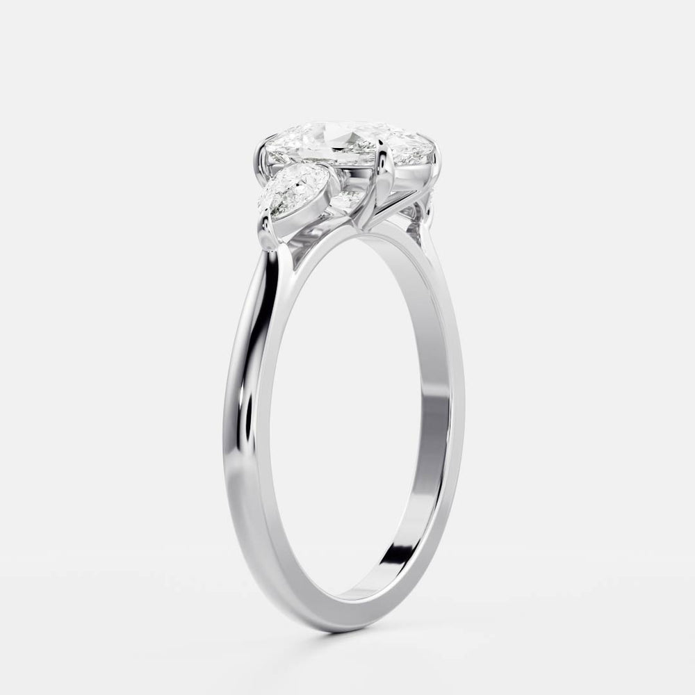 
                      
                        The Florence Ring - Elongated Cushion & Pear Trilogy
                      
                    