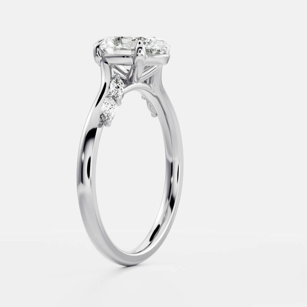 
                      
                        The Amira Ring™ - 1.5ct Moissanite Oval with Marquise Accents
                      
                    