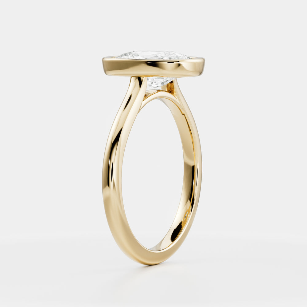 
                      
                        The Ophelia Ring - Elongated Cushion Bezel Solitaire
                      
                    
