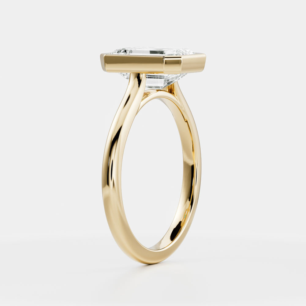 
                      
                        The Audrey Ring - Emerald Bezel Solitaire
                      
                    