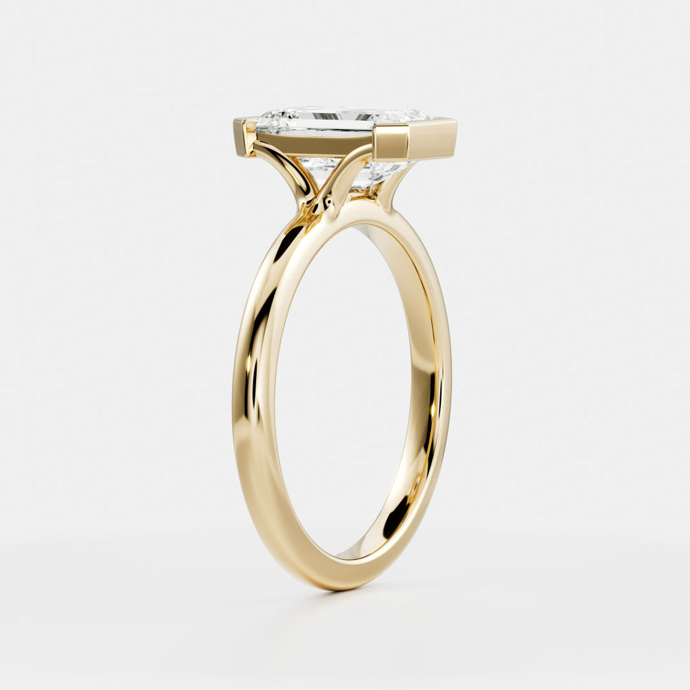 
                      
                        The Audrey Ring - Emerald Half Bezel Solitaire
                      
                    