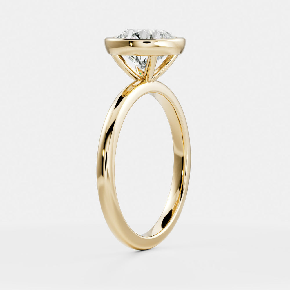 
                      
                        The Isla Ring - Round Bezel Solitaire
                      
                    