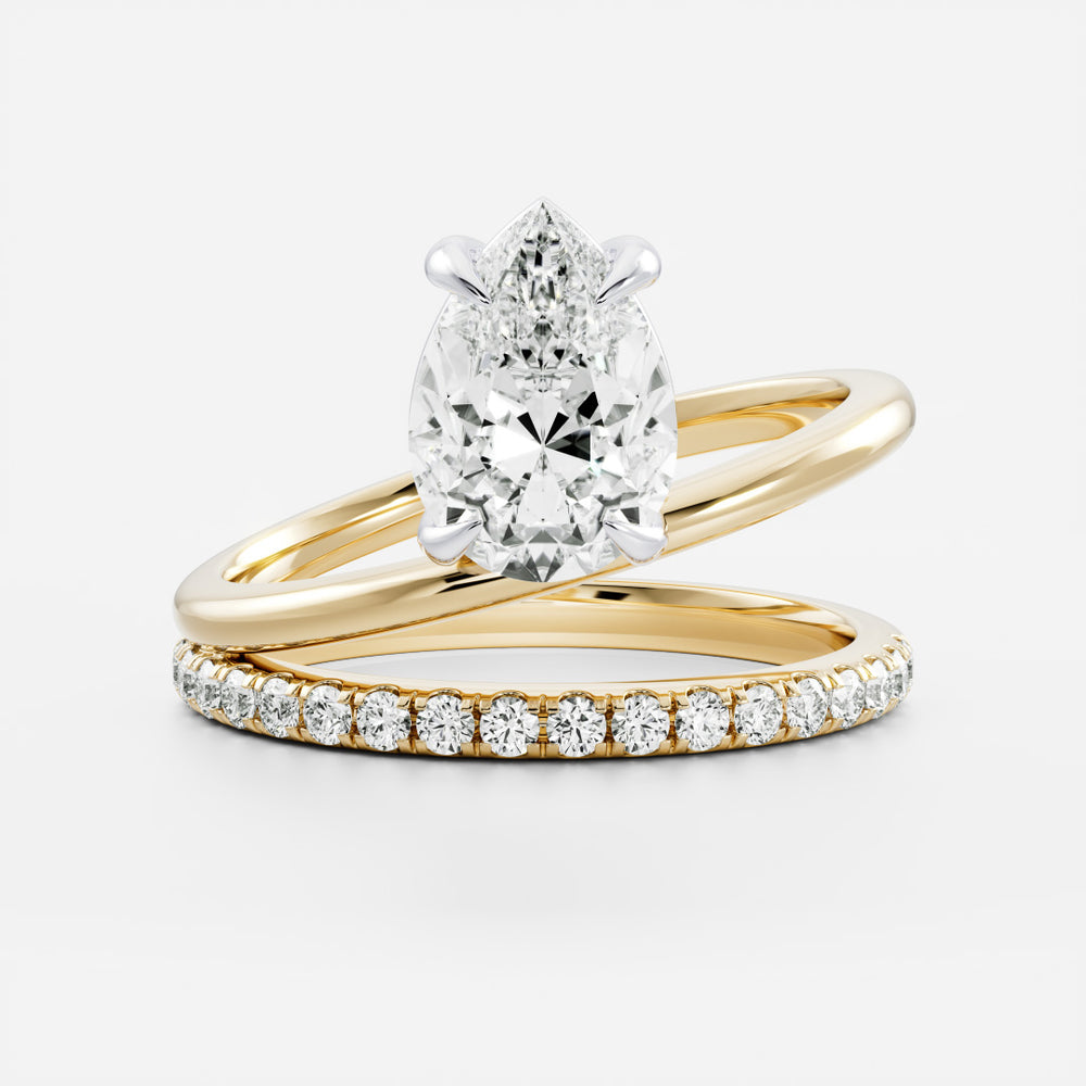
                      
                        The Emerie Ring - Pear Double Band Solitaire
                      
                    