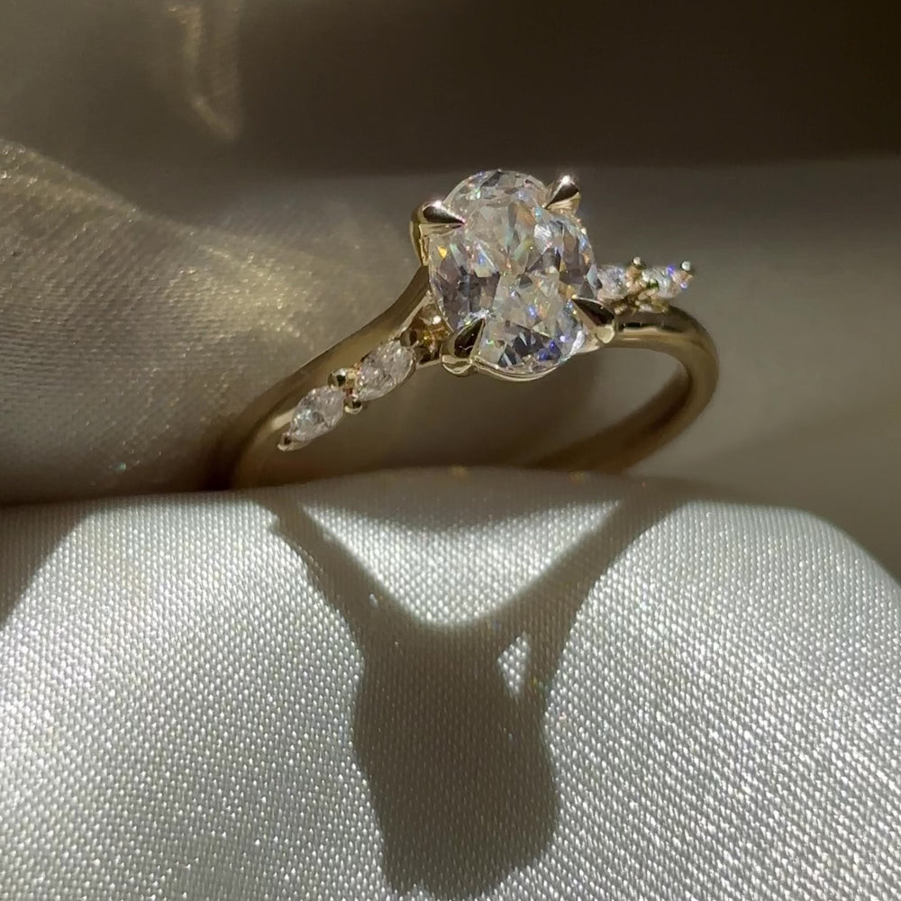 The Amira Ring™ - 1.5ct Moissanite Oval with Marquise Accents