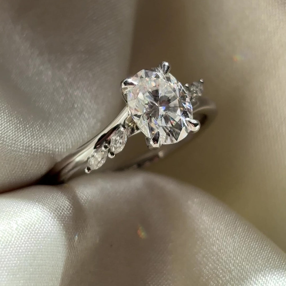 The Amira Ring™ - 1.5ct Moissanite Oval with Marquise Accents