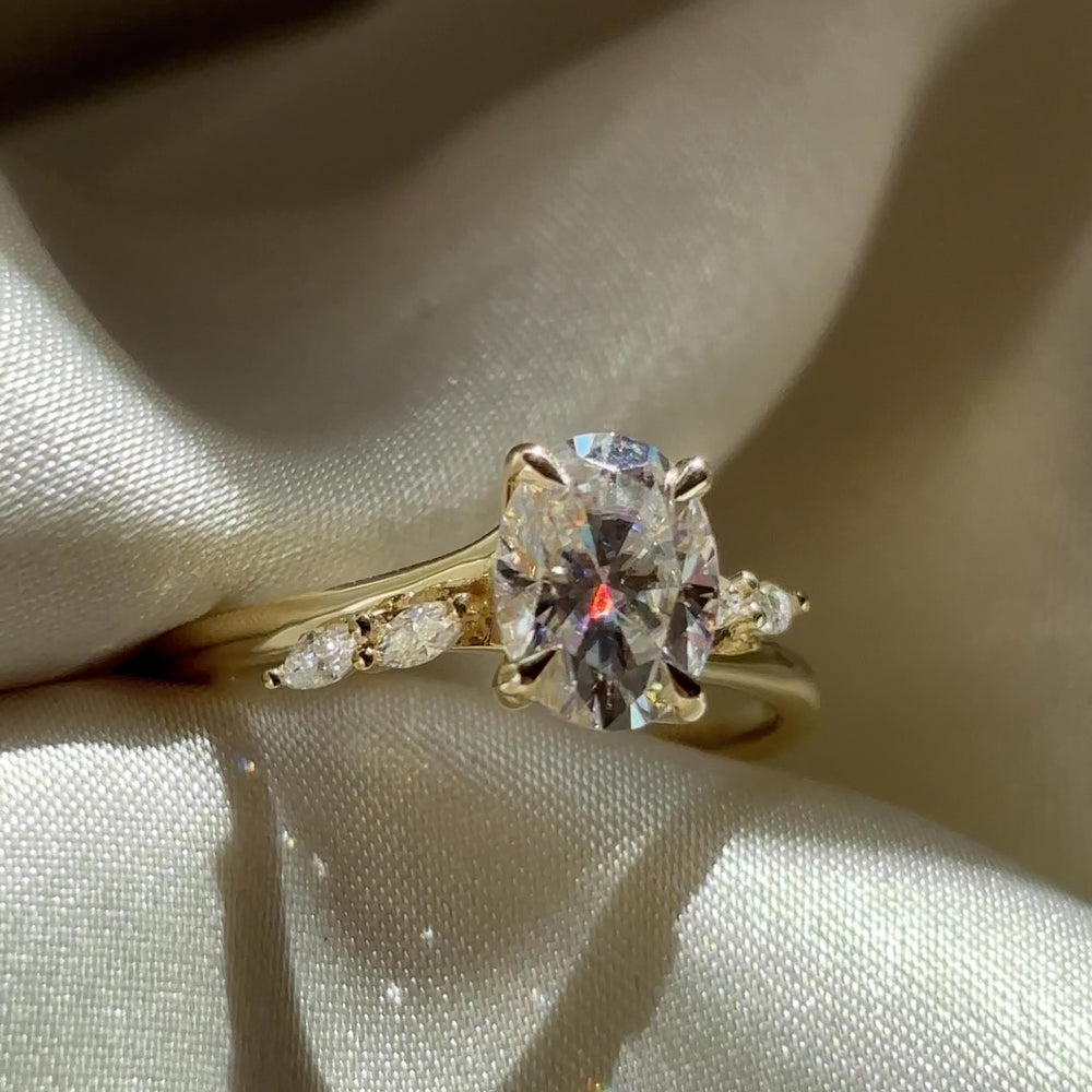The Amira Ring™ - 1.5ct Moissanite Oval with Marquise Accents