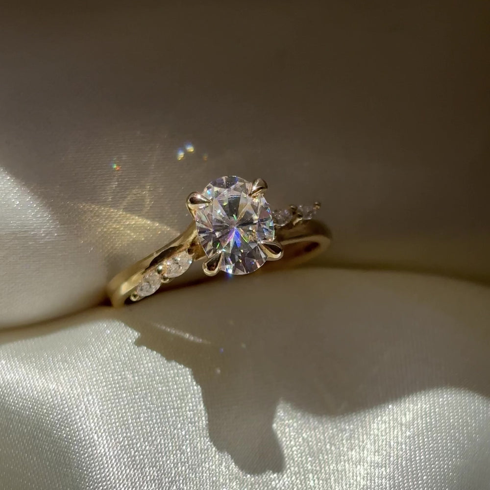 The Amira Ring™ - 1.5ct Moissanite Oval with Marquise Accents