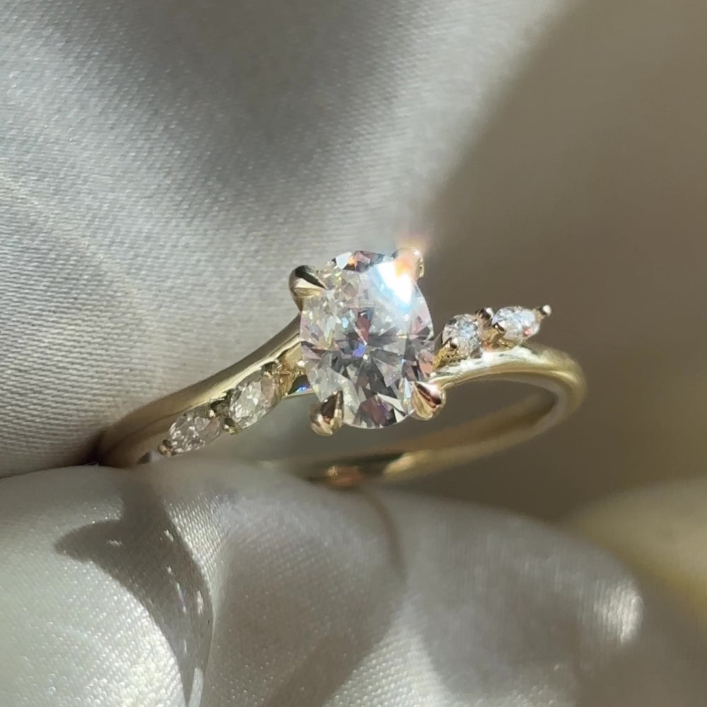The Amira Ring™ - 1.0ct Moissanite Oval with Marquise Accents