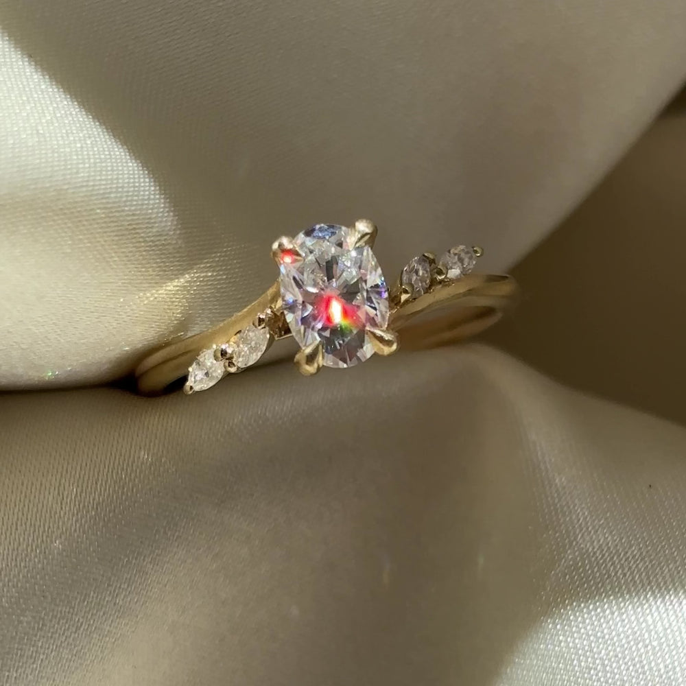 
                      
                        Load and play video in Gallery viewer, The Amira Ring - 1.0ct Moissanite Oval with Marquise Accents
                      
                    