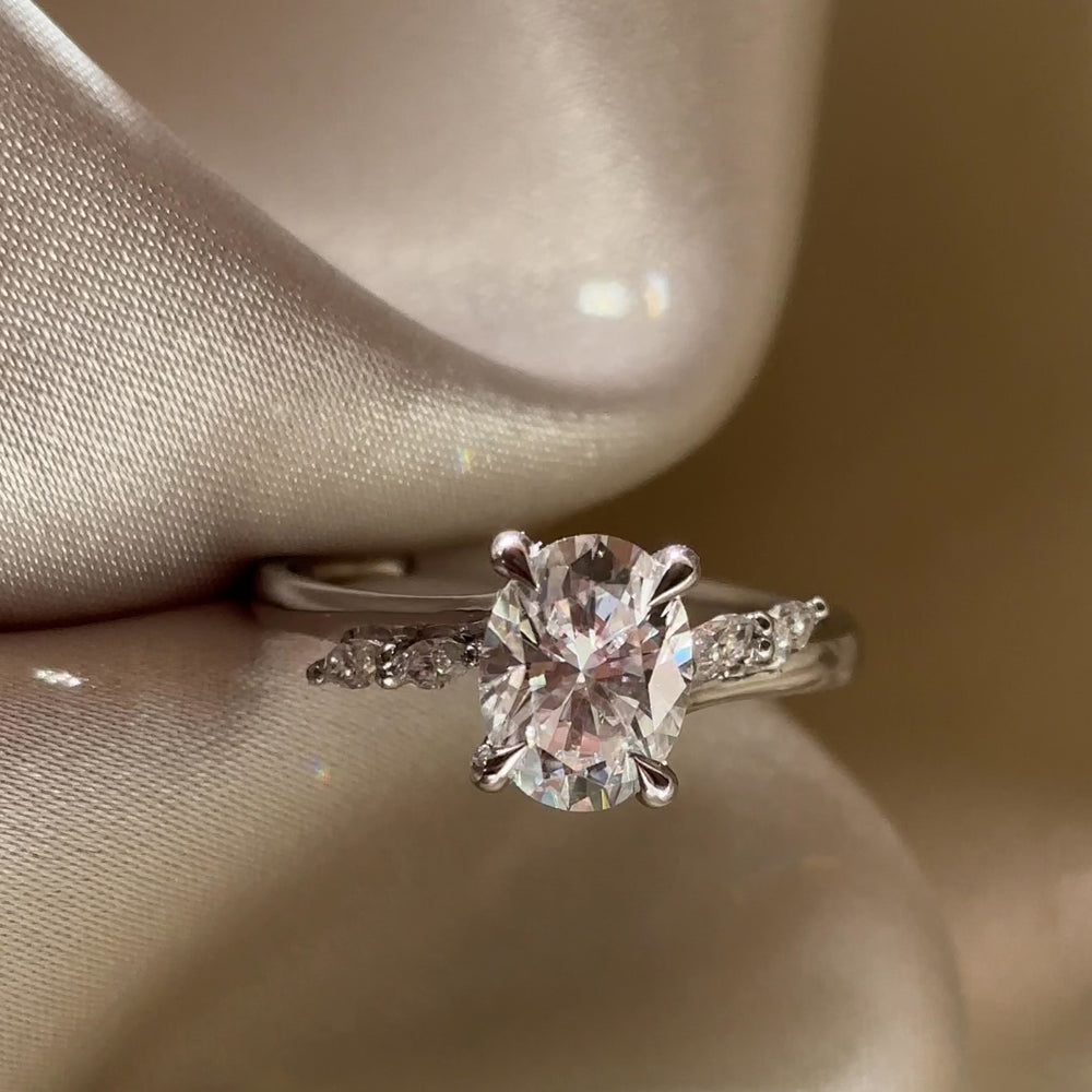 
                      
                        Load and play video in Gallery viewer, The Amira Ring - 1.5ct Moissanite Oval with Marquise Accents
                      
                    